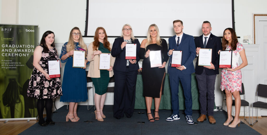 Award winners holding certificates